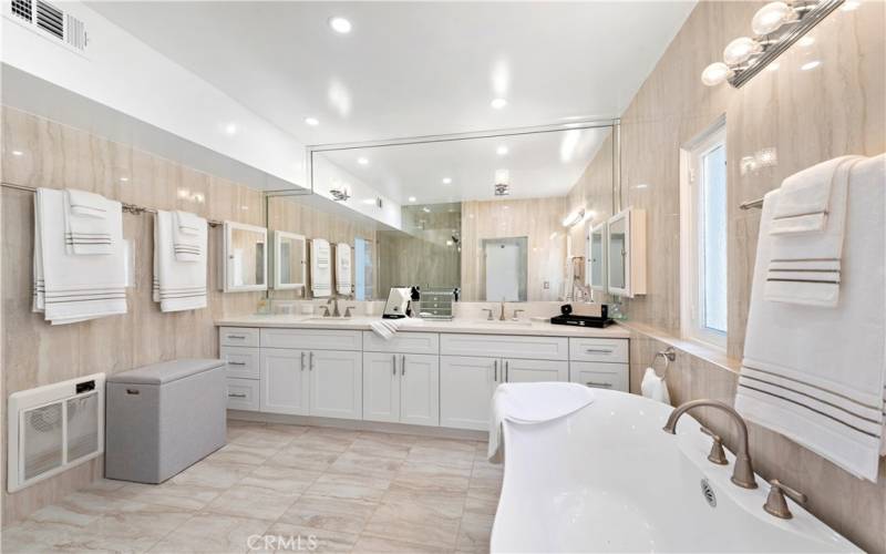You have the choice of a walk-in shower or soaking in the tub...or both!