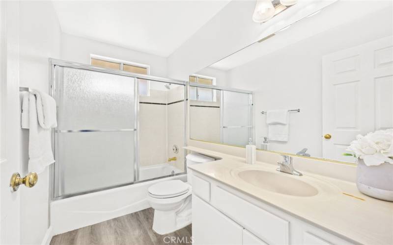 Decent-sized guest bathroom with a window