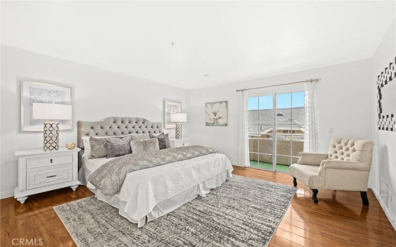 Huge master suite can easily accommodate a king-size bed and includes a charming outdoor balcony