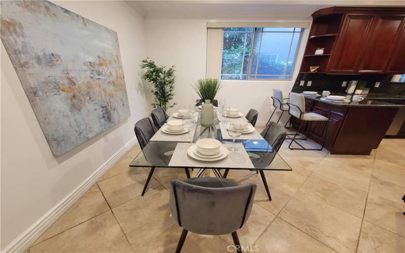 Formal dining opens to kitchen & breakfast bar and has views of greenery