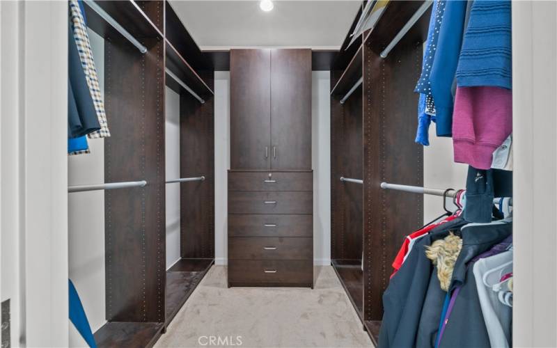 1 of 2 primary walk-in closets