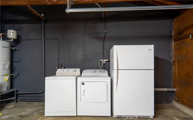 washer & dryer with extra fridge in garage