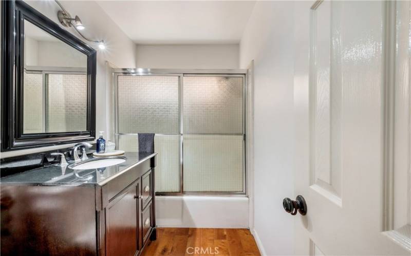 The bathroom has been tastefully updated, boasting ample space and modern fixtures.