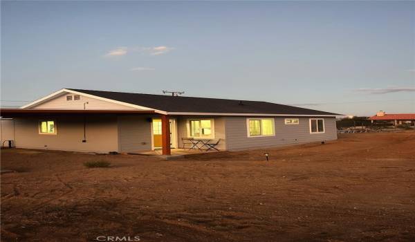 West Facing Exterior in With Carport