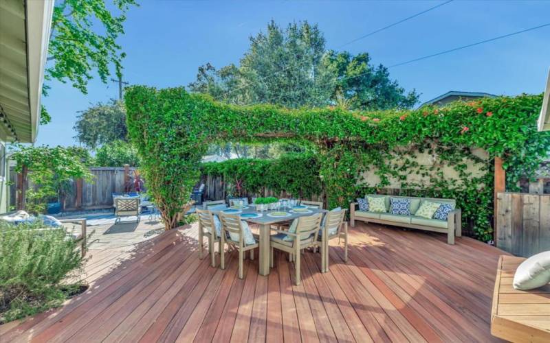 Fabulous outdoor space with Trex type decking and mature plants.