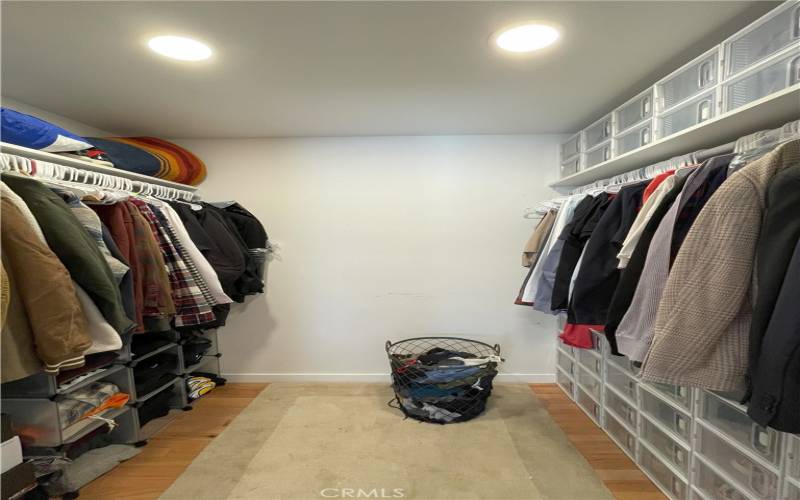 Primary bedroom walk-in closet