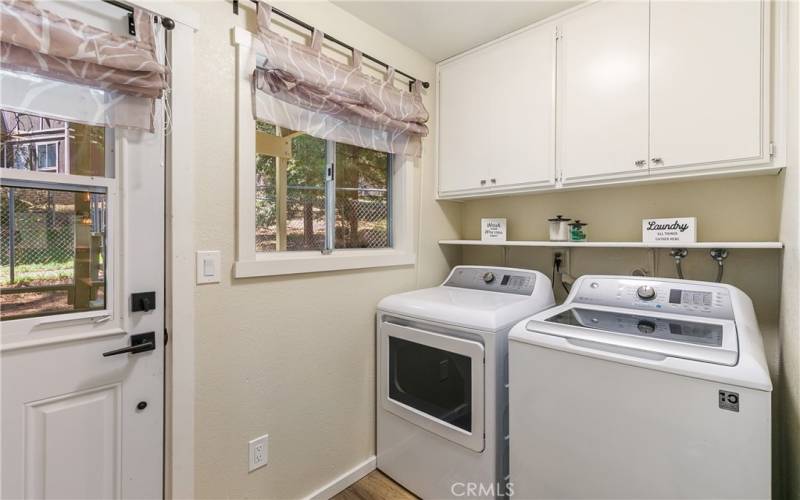 Laundry Room Off Kitchen Leads to Back Deck