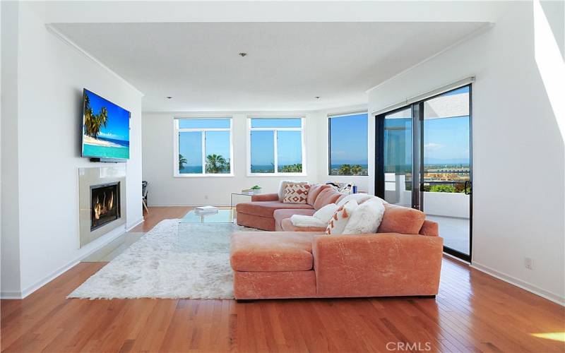 Living Room Opens to Lower Level Deck With Panoramic Views