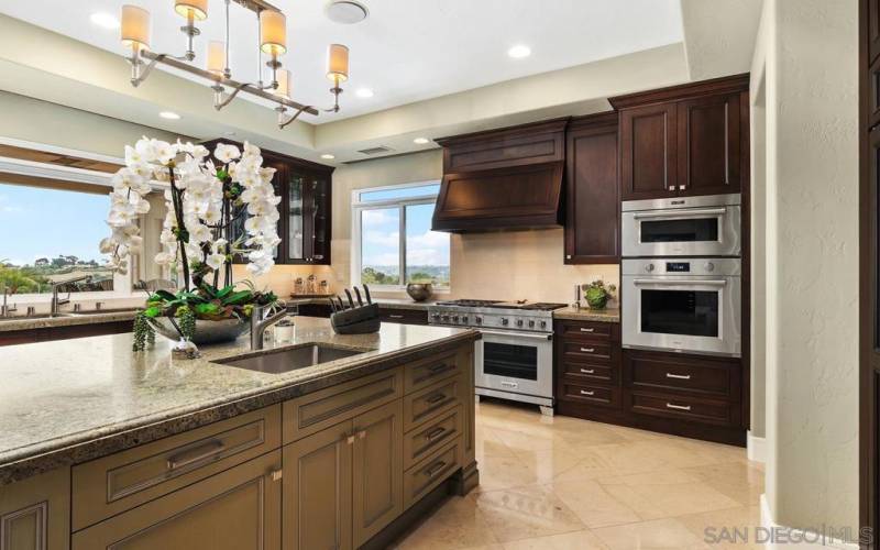 Beautiful gourmet kitchen with two islands and stunning designer touches. The cook in the family is going to love watching sunset while preparing dinner.