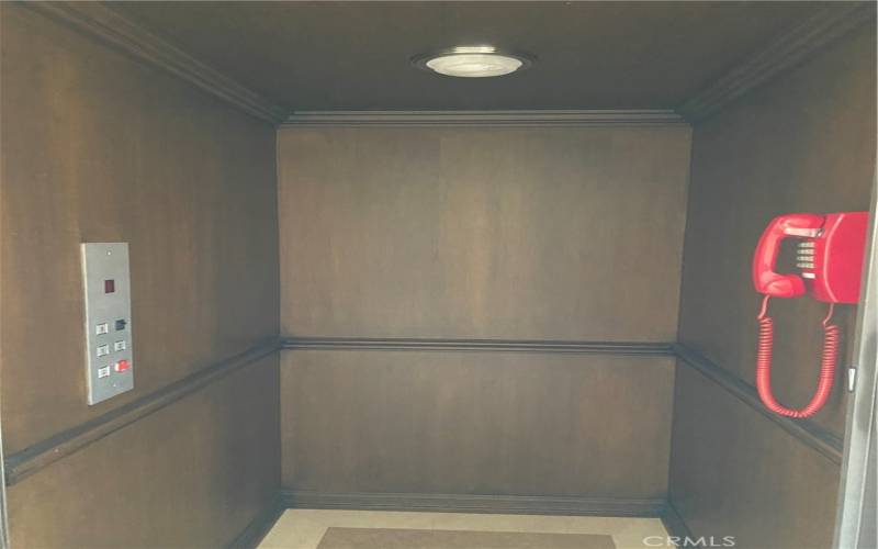 Interior of Elevator/Wood Paneled