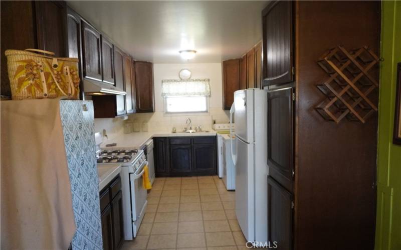 Kitchen with refrigerator included