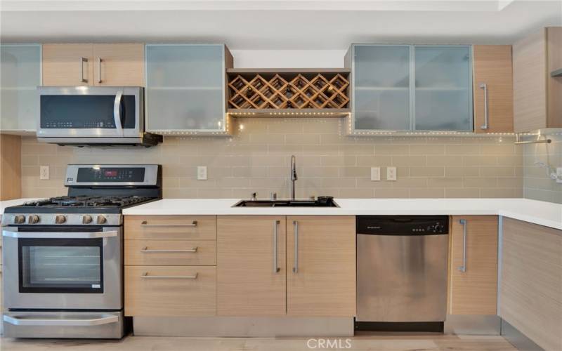 Newly remodeled kitchen with new countertops, backsplash