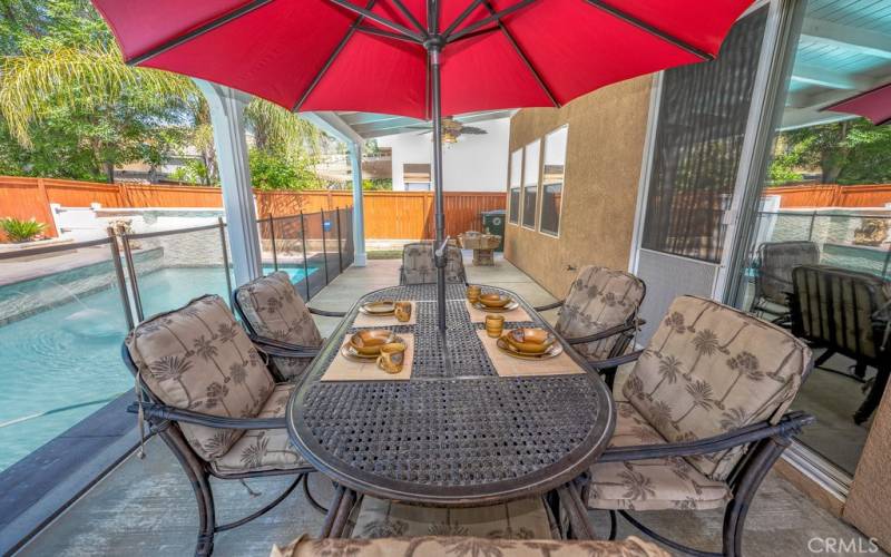 Under patio area, easy kitchen access and pool security fence is easily removed to be stored away.