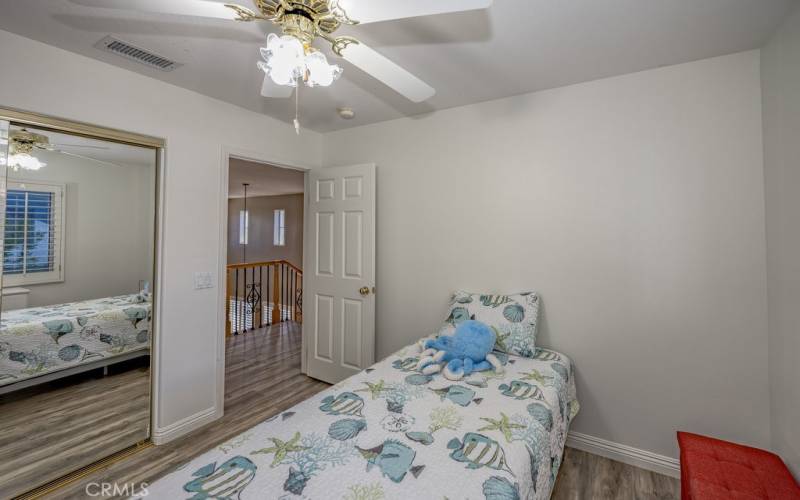 Upstairs bedroom in The Santa Clarita city of Saugus CA home with ceiling fan, on a culdesac.