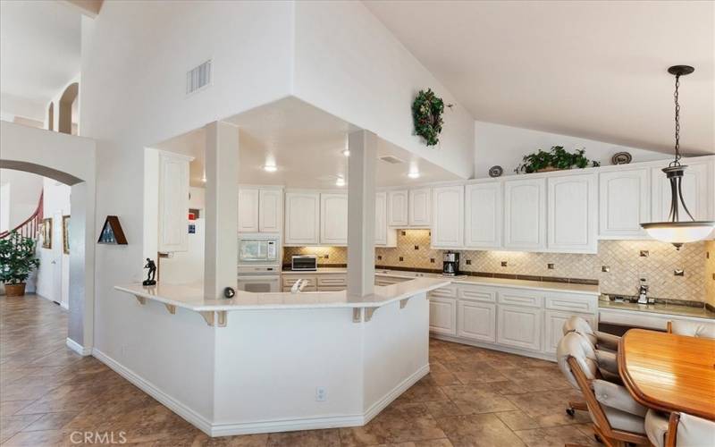 Kitchen looks out to Family Room