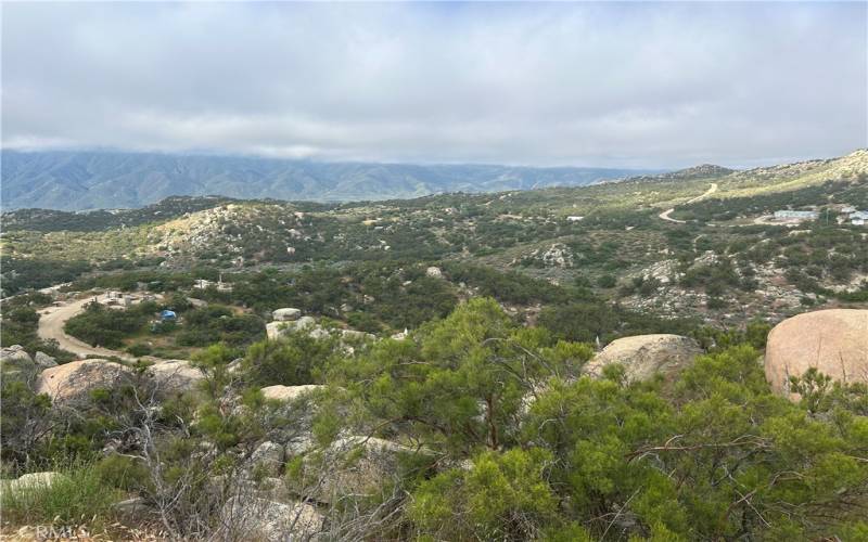 South facing view of Palomar Mountain from upper pad on NW portion of property, looking down on one of many 