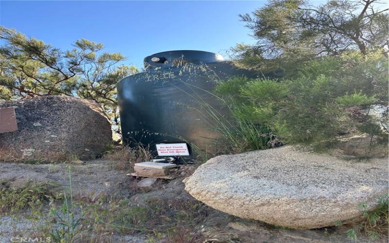 Agriculture water tank on lower part of property