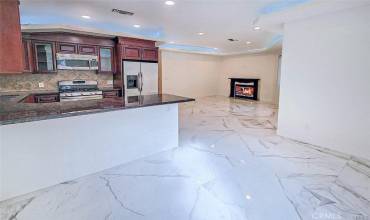 Main house living room w/Elegant Carrara floors,FPLC