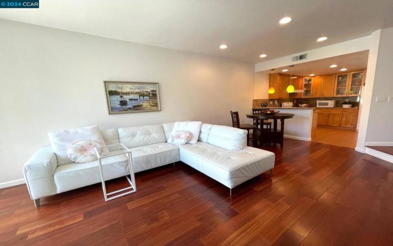 Recessed light and gleaming hardwood throughout