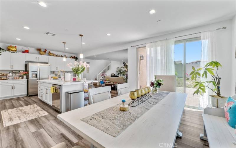 Kitchen and Dining rooms with Sliding Glass doors opening to the backyard patio