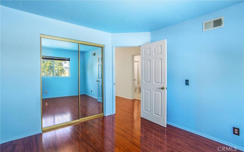 Another view of third bedroom with mirrored closet