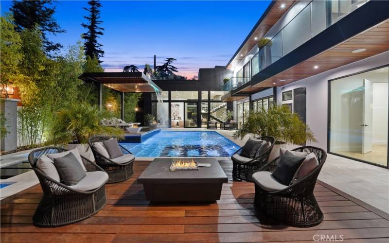 Splendid Backyard...this Paradise features Sparkling Pool & Spa w/ a Glass Tile Surface, Covered Patio by the Pool w/ 2 Waterfalls & 2 Firepits, multiple Lounge Areas & Fully Equipped Outdoor Kitchen. Perfect for the most Extravagant Affairs!