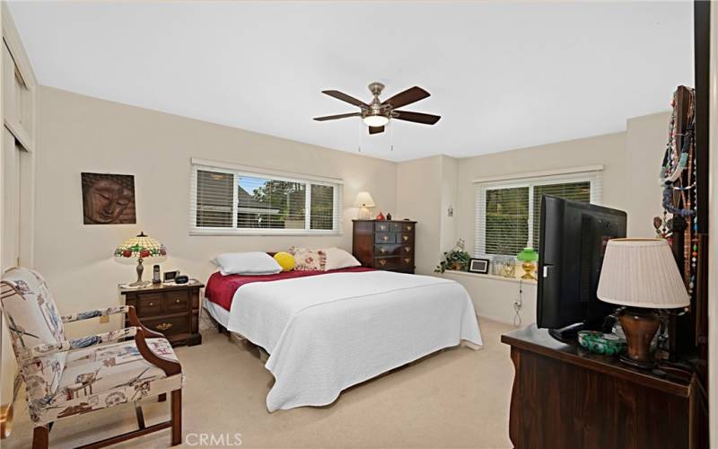 Main Bedroom Facing the front of the home, this room has windows on two walls bringing in natural light.