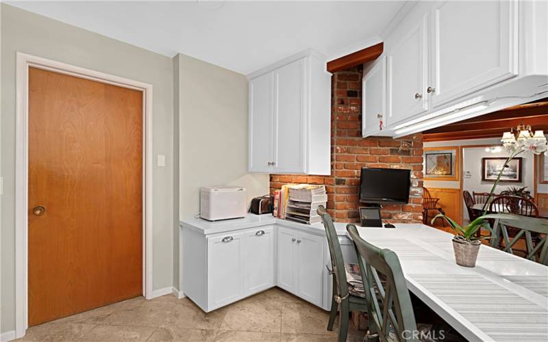 The laundry room is easily accessible from the kitchen