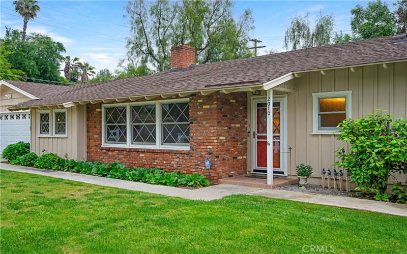 Notice the front windows which bring natural light into the home. They are all custom, double pane windows made to replicate the original look of the home.