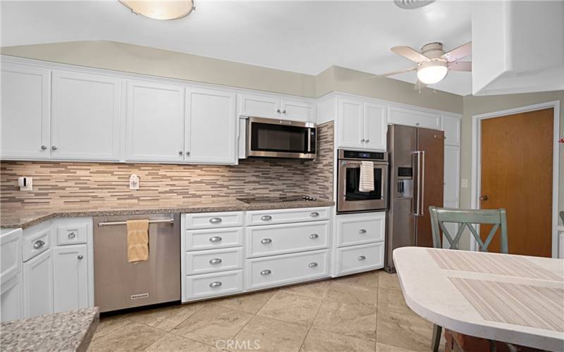 Plenty of counter space and storage! The door to the right leads to the laundry room.