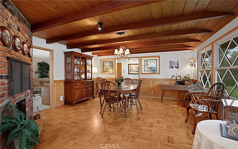 View of the dining room from the kitchen breakfast counter. This room has access to the entry and directly to the living room. There is enough space to have a sitting area as well as your dining room table.