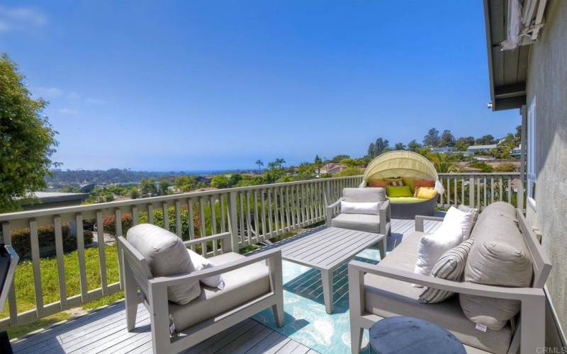 Large side deck with space for entertaining and ocean view.