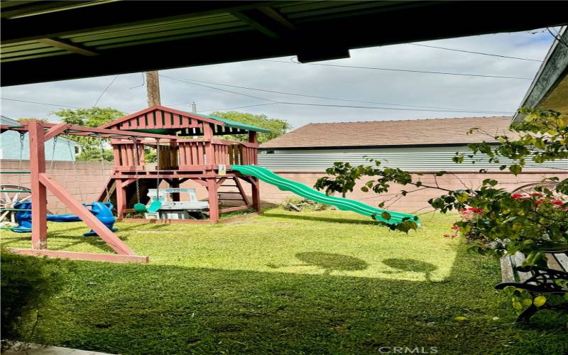 Backyard View from patio doors. Kids Playset is included with the sale.