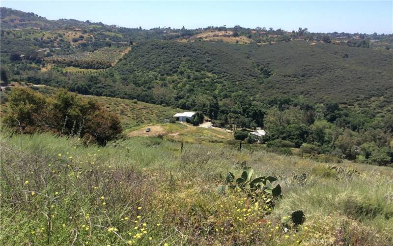 View of the home and the garage from the hill