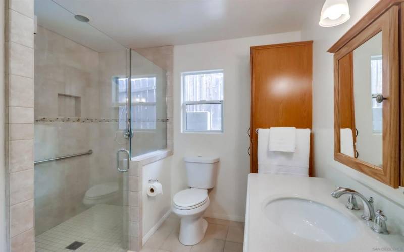 Guest House Bathroom with Walk- in shower & Handicap grab bar.