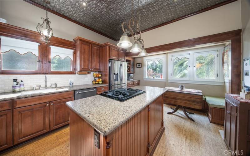 Kitchen with tin ceiling and breakfast nook.