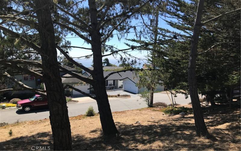 Mid level on the lots the westerly views get even better. Pine trees within the footprint of a future home will have to go.