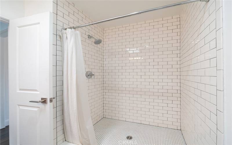 walk-in shower in one of the bathrooms