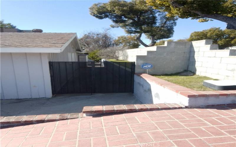 Side gate leading to the backyard.