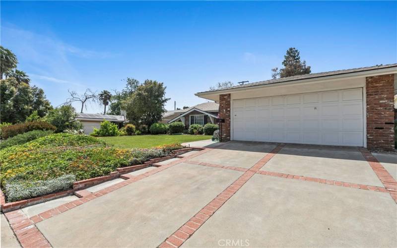 2 Car Garage with Opener. Driveway with Brick Ribbon, Low Step Walkway side of Drive