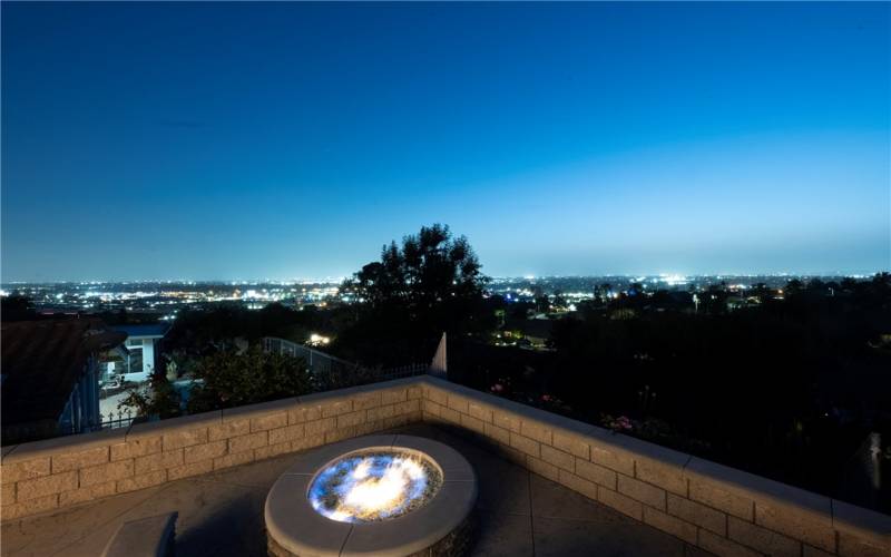 Sit at the open fire pit looking at stunning 180 degree views.