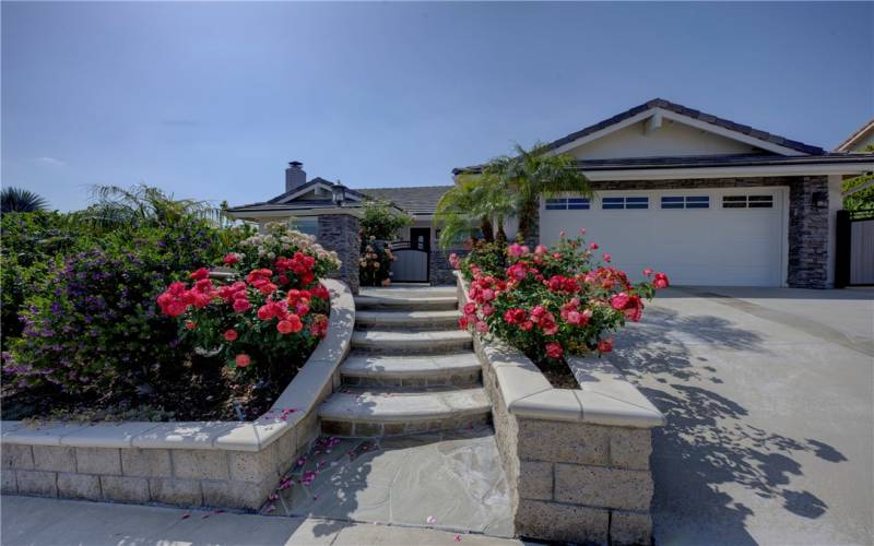 Beautiful roses adorn the front and back of this wonderful property.