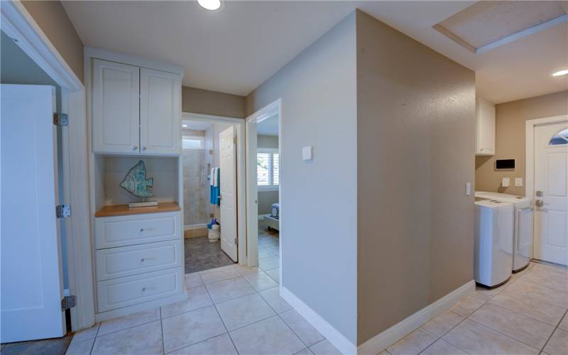 The hallway leads to all 3 bedrooms and the laundry area.