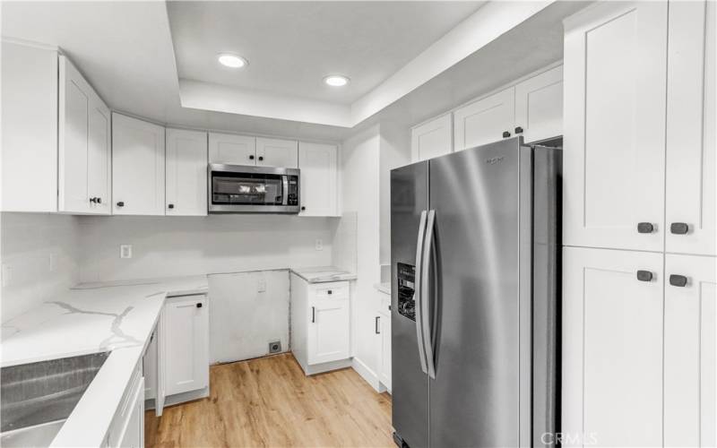 Brand new dishwasher, refrigerator, microwave/vent, and range