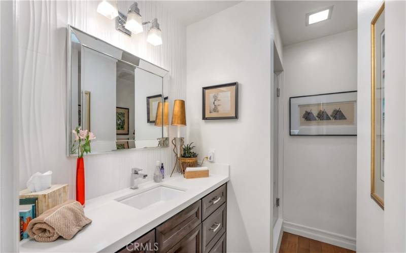 2nd bathroom has quartz counters, a walk-in shower and high quality finishes.