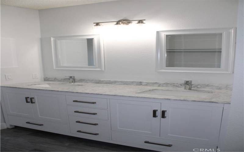 Double sink vanity in main bedroom closet