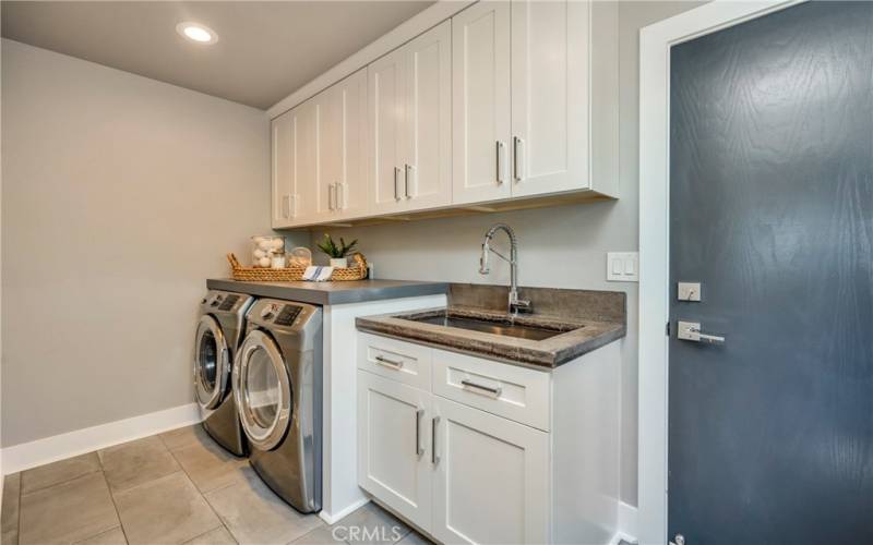 Oversized utility room with sink off garage