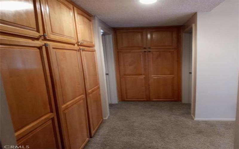 Hallway with Ample Storage Cupboards