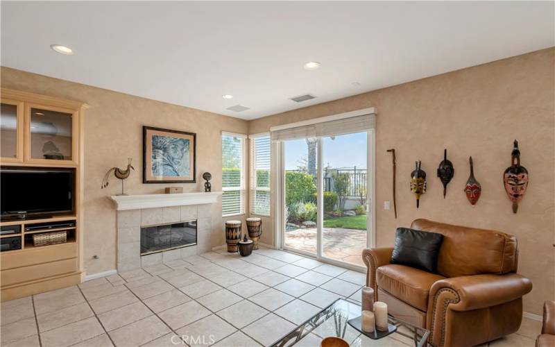 Family room w/fireplace, Built-in entertainment center & opens to backyard!