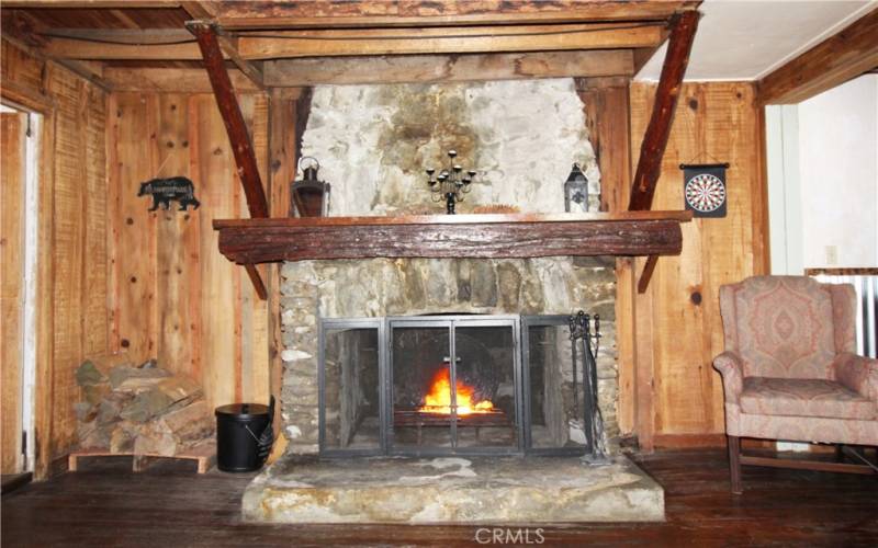 Stone fireplace with live edge mantel